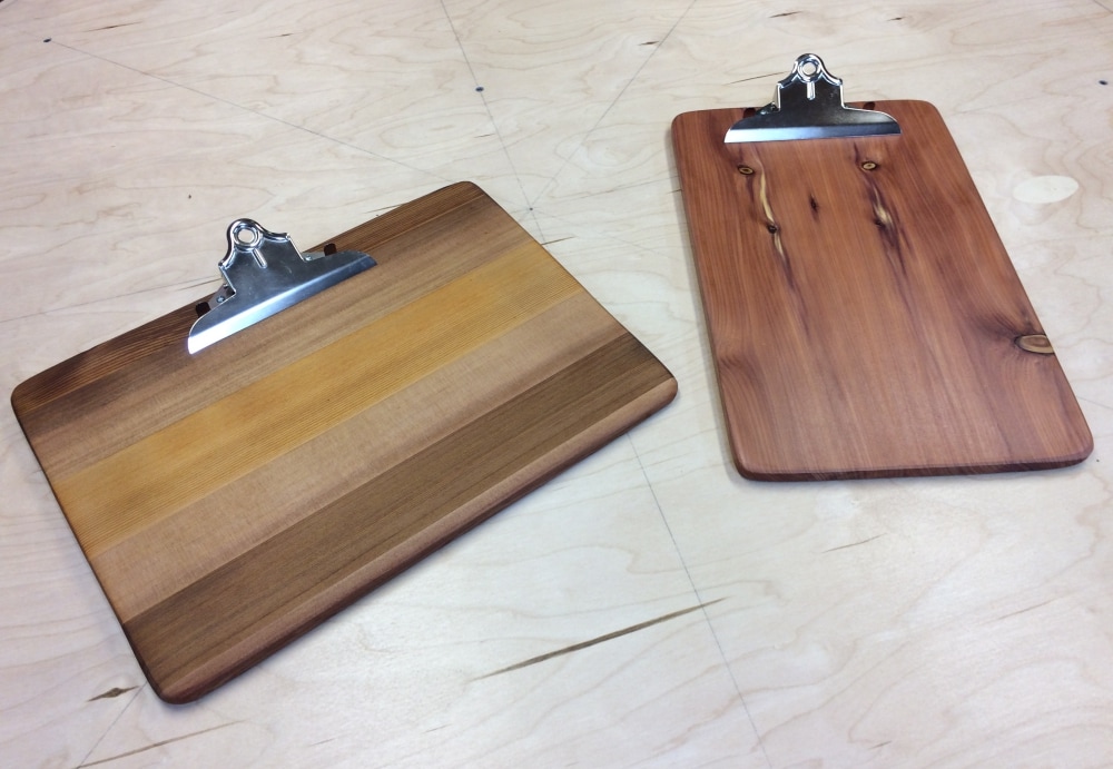 Landscape and portrait style clipboards made from old wooden playsets.